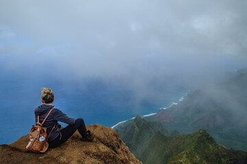 a man sitting on a rock