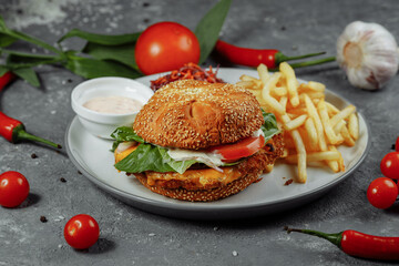Fresh and fried fish burger with vegetables