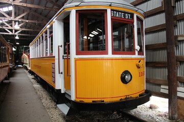 The yellow trolley in Seashore Trolley Museum in Maine.