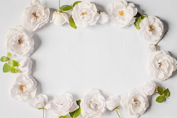 Fototapeta na wymiar Floral frame wreath of white rose flower buds on white background. Flat lay, top view mockup.