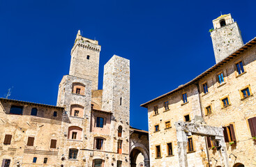 Fototapeta premium Medieval towers of San Gimignano, UNESCO world heritage in Tuscany, Italy