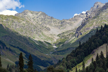 Fototapeta premium Brown round vintage old street lamp against the backdrop of mountains and blue sky with blurry background, used as a background or texture, soft focus
