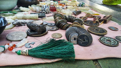 Antique stalls, display and sale of ancient coins, snuff bottles and so on. In Shenzhen, China.