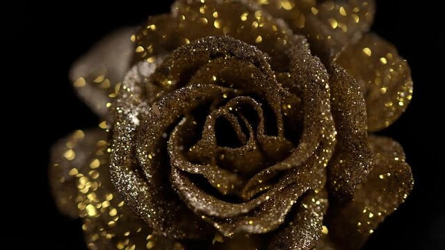 Golden rose blossom with glitter - decorative background videoclip