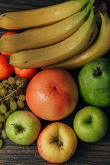 Composition with Summer Colorful Fresh Fruits on Wooden Brown Background
