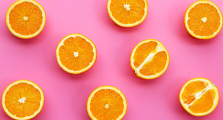 High vitamin C, Juicy and sweet. Fresh orange fruit on pink background.