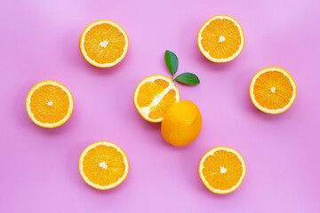 High vitamin C, Juicy and sweet. Fresh orange fruit on pink background.