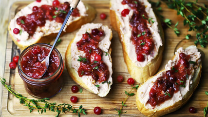 Sandwiches with turkey or duck pate and cranberry sauce. Festive snack.