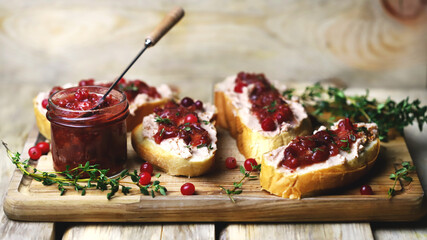 Sandwiches with turkey or duck pate and cranberry sauce. Festive snack.