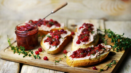 Sandwiches with turkey or duck pate and cranberry sauce. Festive snack.