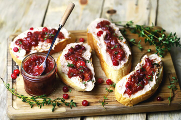 Sandwiches with turkey or duck pate and cranberry sauce. Festive snack.