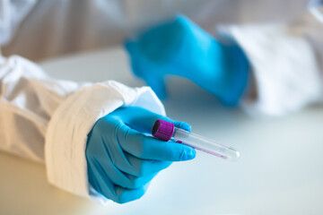 Process of coronavirus testing examination by nurse medic in laboratory lab, COVID-19 swab collection kit, test tube for taking OP NP patient specimen sample, patient receiving a corona test