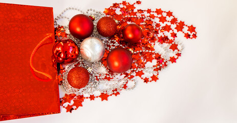 Christmas tree balls and tinsel in red and silver colors with copy space