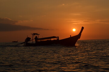 view of the sunset over a boat 