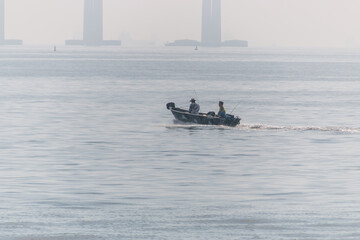 fishermen in a small boat in the guanabara bay in Rio de Janeiro, Brazil