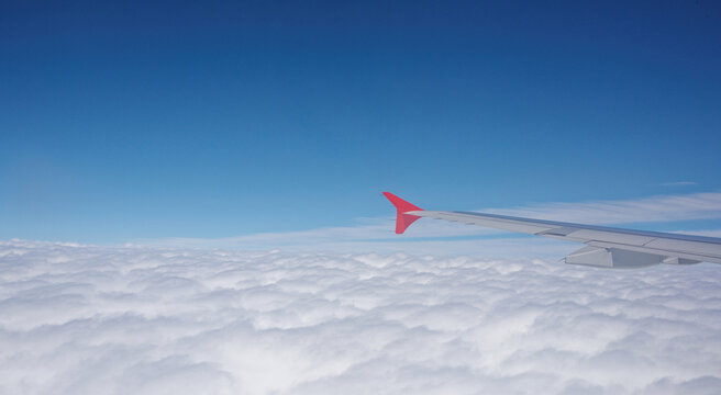  Paris Charles de Gaulle Airport.View from the plane to the clouds over the suburb of Goossenville