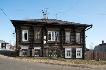 Two-story log house built in the 2 half of the 19th century, the Bolshevik Ada Lebedeva lived in it in 1905-1906, what is written on the table.