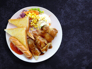 steak fish salad with sausage and toasted bread on plate, Top view food  and vegetable on background