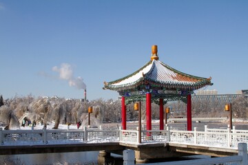 Fototapeta premium Changchun, Jilin, China: Chinese Architecture pavilions on the lake. Winter landscape.