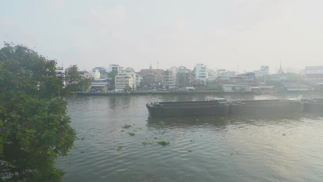 Sand carrying vessel on the Chao Phraya River, Bangkok, Thailand in the morning