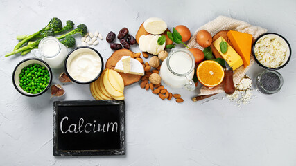 Healthy diary and non-diary products rich in calcium on grey background