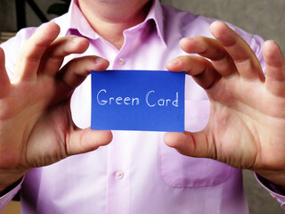 Business concept meaning Green Card  with inscription on the piece of paper.