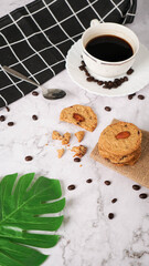 breakfast frothy espresso coffee accompanied by delicious almond cookies