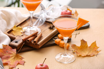 Glass of tasty pumpkin pie martini on table
