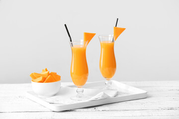 Glasses of tasty pumpkin pie martini on table