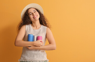 Beautiful African-American woman with soda on color background