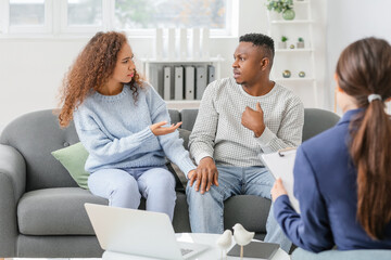 Psychologist working with African-American couple in office