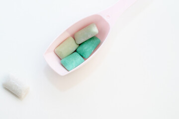 chewed gum in a plastic cap