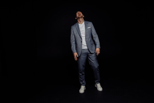 Full Length Body Size Photo Of Cheerful Man Wearing Stylish Suit Laughing Overjoyed  Isolated Black Color Studio Background With Copyspace