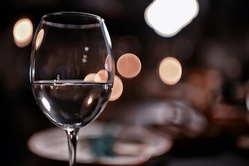 glass white wine restaurant interior, abstract evening dinner with alcohol at the bar