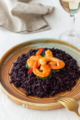 Black rice risotto with shrimp. Sea food. Diet. Healthy eating.