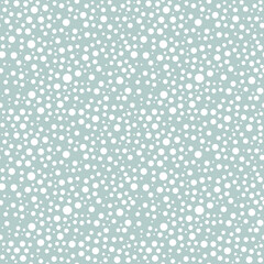 Seamless background with random white round elements. Abstract ornament. Dotted abstract pattern