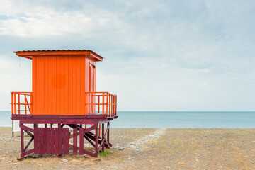 Lifeguard tower on a sandy beach in the early morning, no people