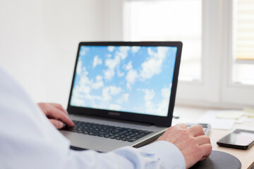Fototapeta premium Businessman working remote at home with laptop