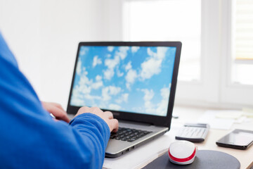 Man working remote at home with laptop