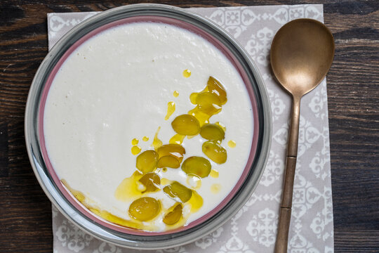 Traditional Spanish dish, cold soup ajo blanco or ajoblanco from garlic, almonds, white wine vinegar, olive oil and grapes