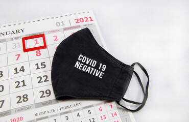 Face shield lying on the 2021 calendar page