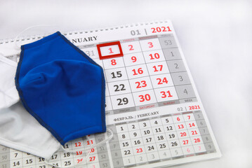 Face shield lying on the 2021 calendar page