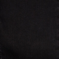 Black and blue denim background. Jeans texture.