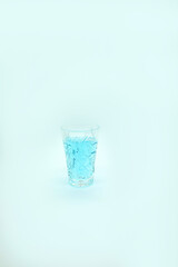 blue alcoholic drink in a decanter. Cocktail with blue gin , tonic