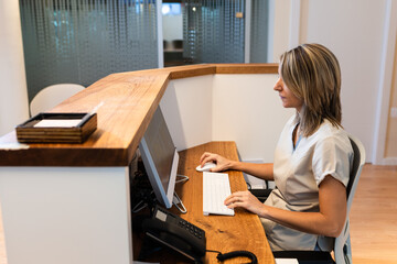 young woman at the reception of fitness club or health centre