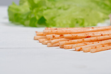 Chechil cheese and lettuce on a light wooden background