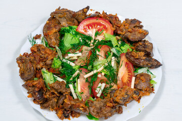 warm salad chicken liver close-up