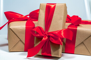 three gift box with red ribbon
