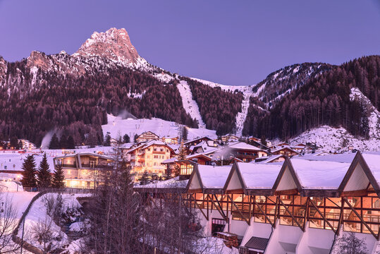 Winter ski resort Selva di Val Gardena in Italian Alps at dusk