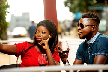 young couple self-photographing, happy.